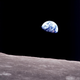 View of Earth while orbiting the Moon.